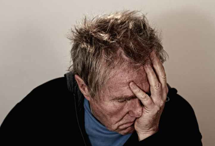 man old depressed headache