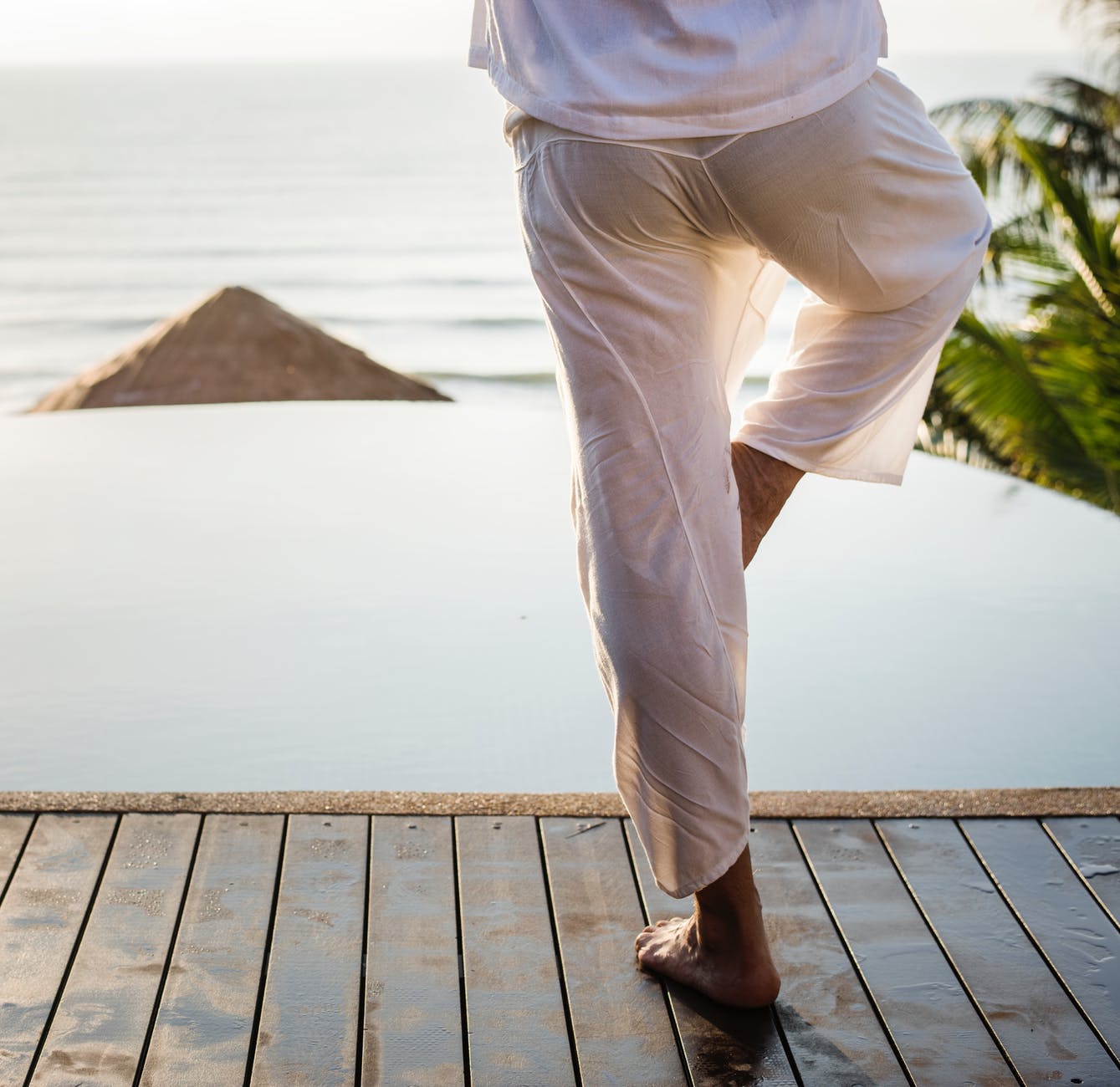 person standing on boardwalk