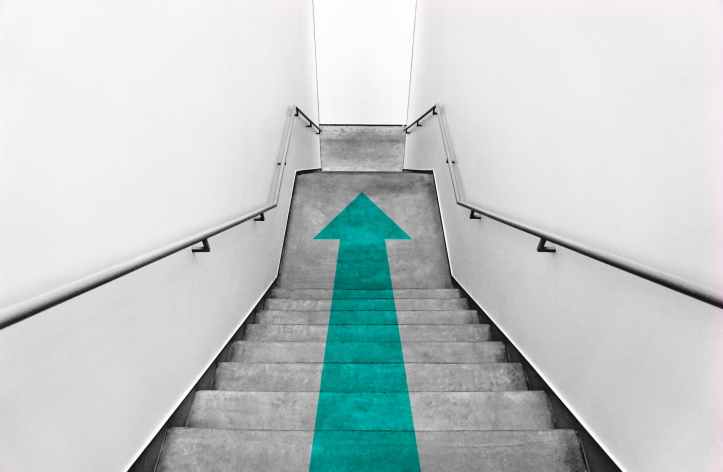 green arrow on stairs
