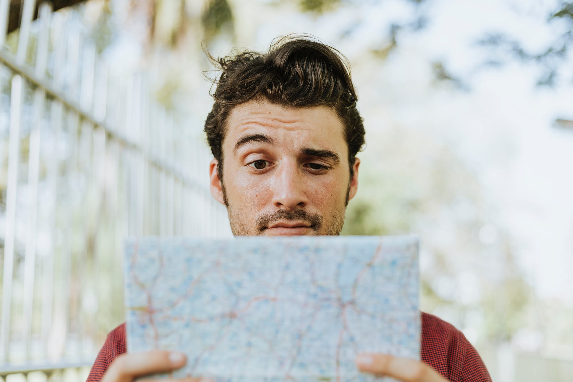 man holding white paper