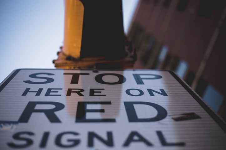 worm s eye view photography of stop signage