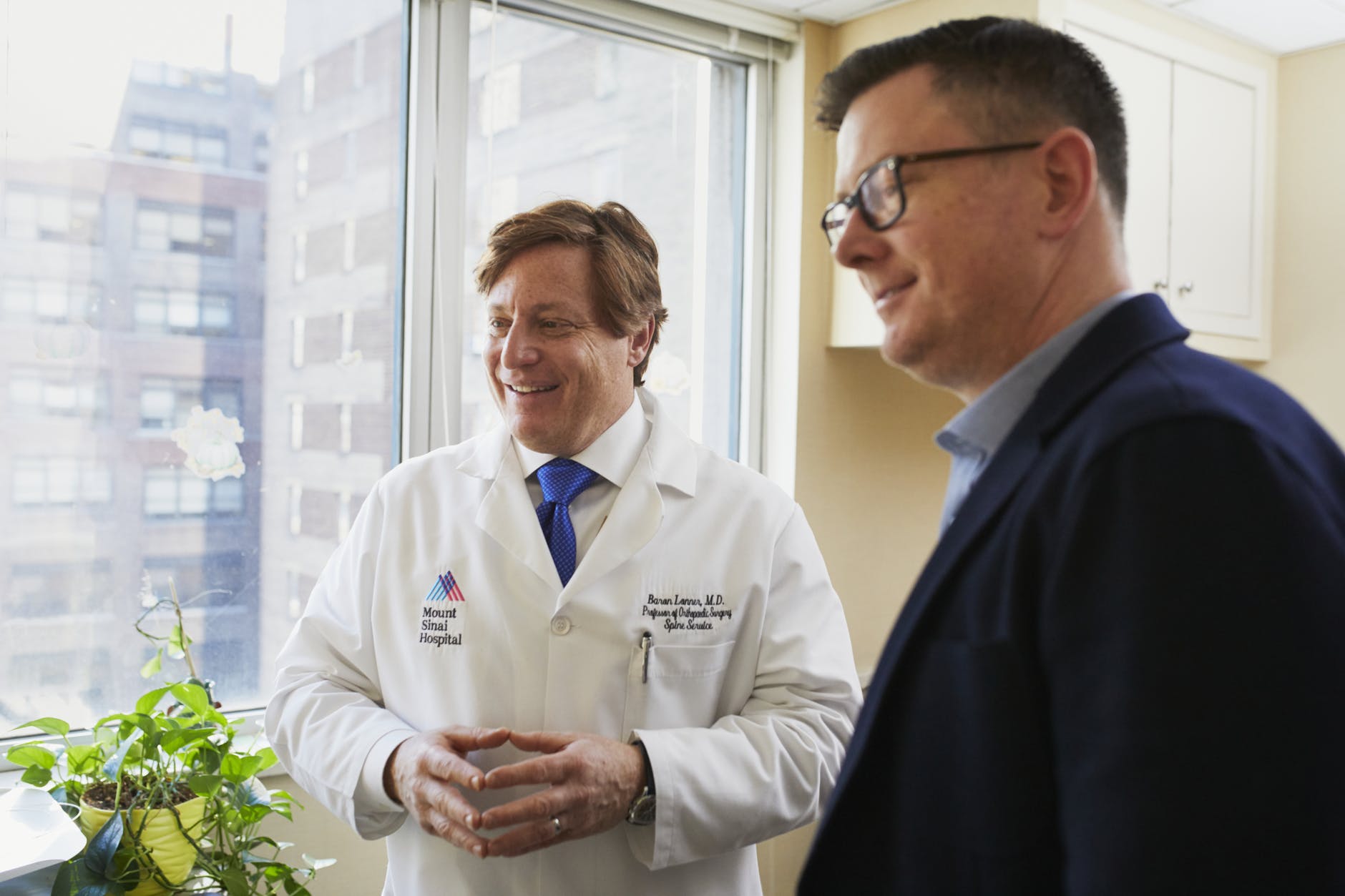 man next to doctor