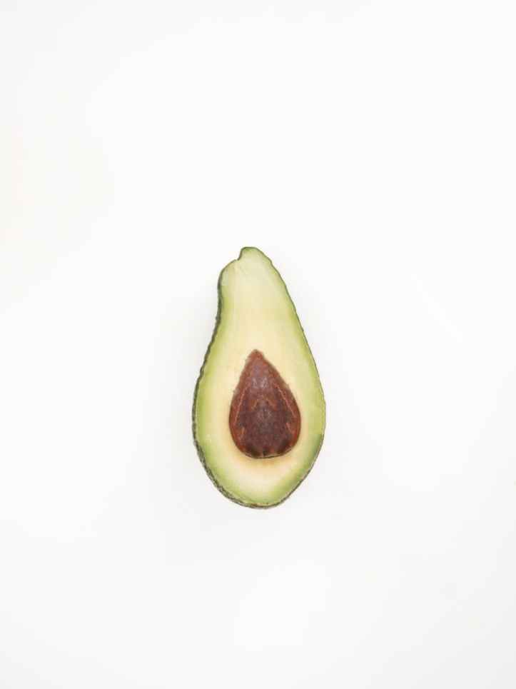 photo of half cut avocado