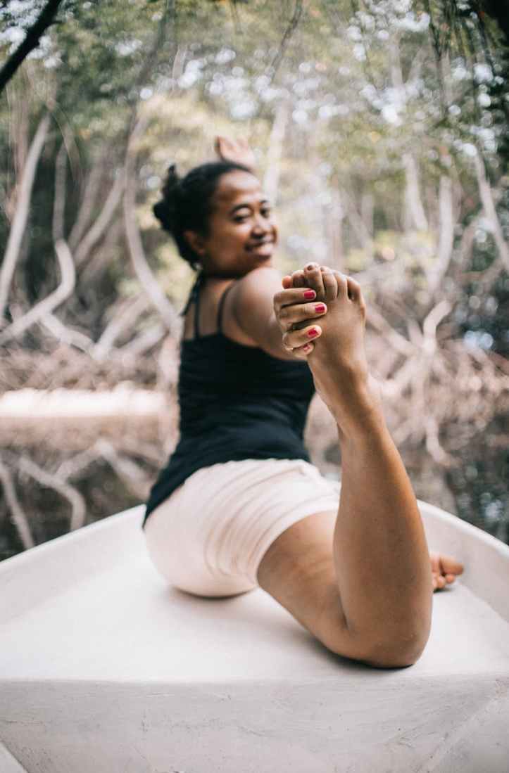 photo of woman stretching her body