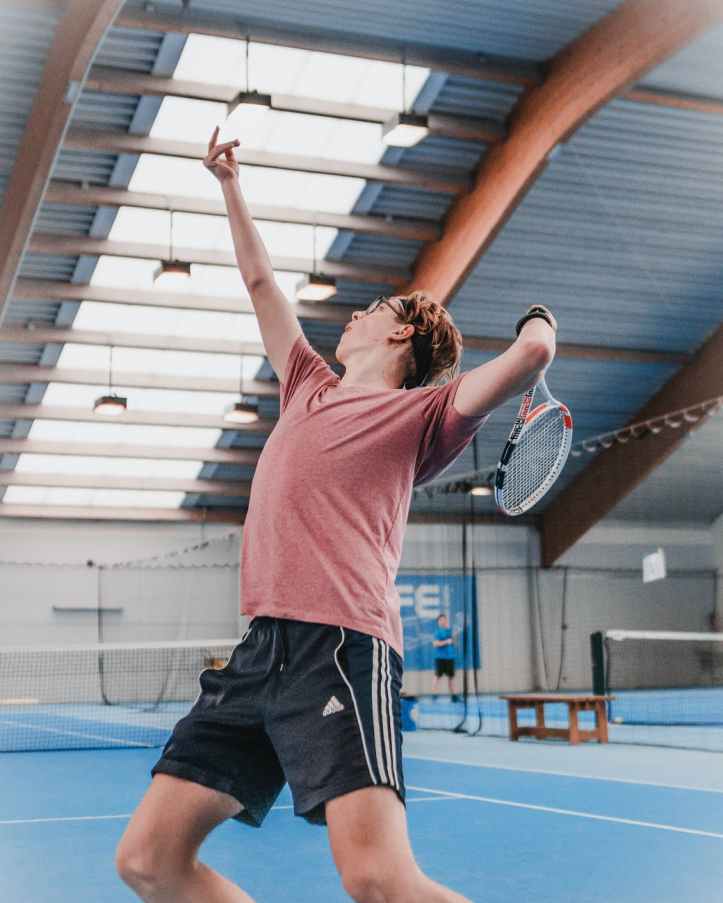 photo of man playing tennis