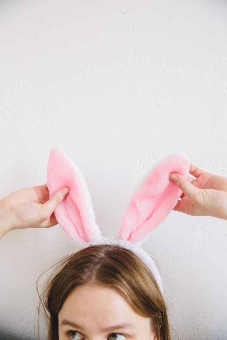 person with bunny ears